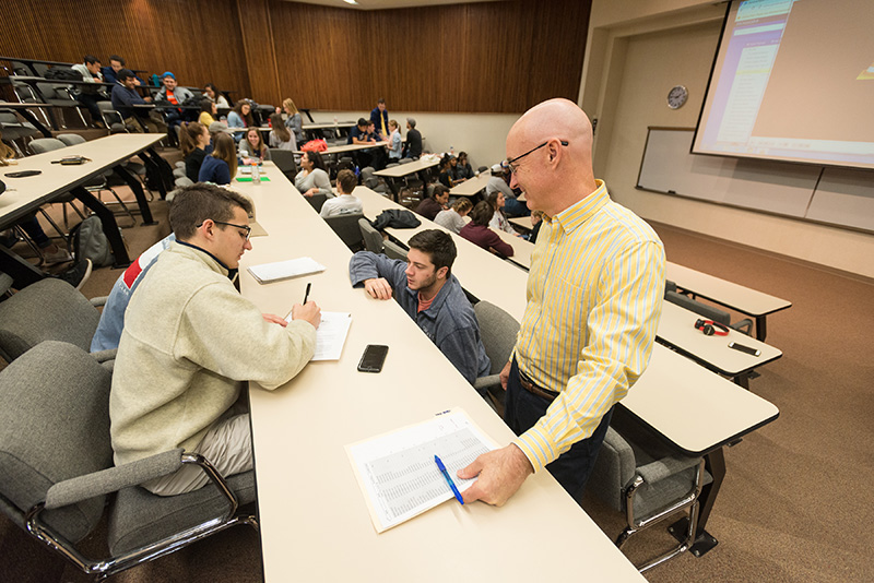 Students and professor working in class